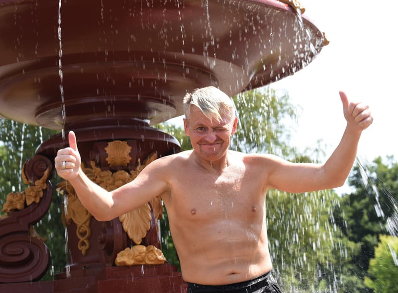 Keeping cool -  Wiganers have fun in the sun at Mesnes Park, Wigan.