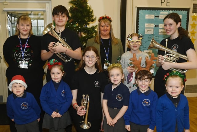 Members of the Fred Longworth High School brass band entertain pupils at the Winter Wonderland celebration party at Hindsford CE Primary School, Atherton.