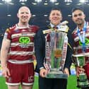 Wigan head coach Matt Peet, captain Liam Farrell and Rob Burrow Award winner Bevan French celebrate withy the trophy