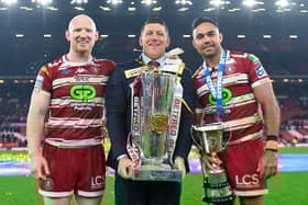 Wigan head coach Matt Peet, captain Liam Farrell and Rob Burrow Award winner Bevan French celebrate withy the trophy