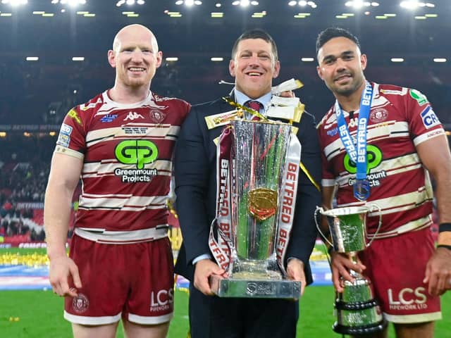 Wigan head coach Matt Peet, captain Liam Farrell and Rob Burrow Award winner Bevan French celebrate withy the trophy