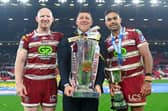 Wigan head coach Matt Peet, captain Liam Farrell and Rob Burrow Award winner Bevan French celebrate withy the trophy