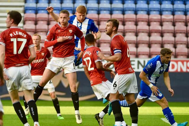 Josh Stones fights for the ball in the during the first half against Morecambe