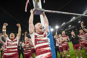 Liam Farrell lifts the Betfred Super League trophy