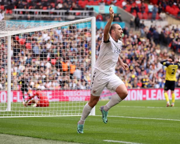 Michael Cheek celebrates scoring for Bromley in the Vanarama National League play-off final against Solihull Moors at Wembley last year
