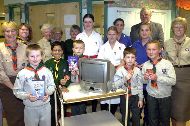 A portable TV and video player presented to the children's ward of Wigan Infirmary