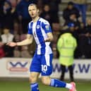 Will Keane celebrates scoring his penalty against Sutton