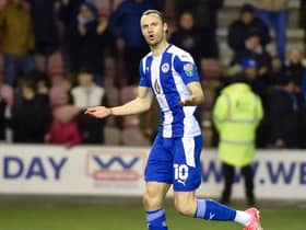 Will Keane celebrates scoring his penalty against Sutton