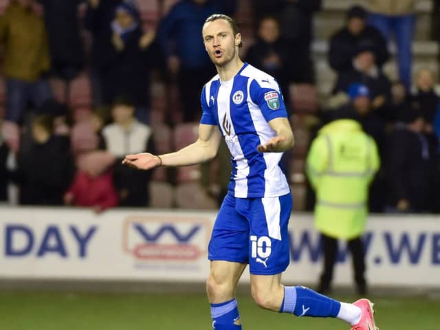 Will Keane celebrates scoring his penalty against Sutton