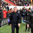 Ryan Lowe walks out to take charge of Latics for the first time at Charlton, flanked by Andy Lonergan (left) and Jimmy Barrow (right)
