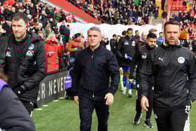 Ryan Lowe walks out to take charge of Latics for the first time at Charlton, flanked by Andy Lonergan (left) and Jimmy Barrow (right)