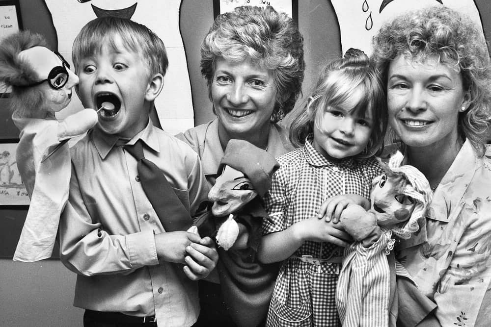 Open wide.....Obliging the puppet dentist with the examination is Daniel Brooks, a pupil from Holy Family Primary School, New Springs. He was attending a dental health talk and show at Standish Clinic by dental health educators, Ruth Chapman and Sonia Griffiths, from Wigan and Leigh Community Dental Service on Tuesday 10th of May 1994.