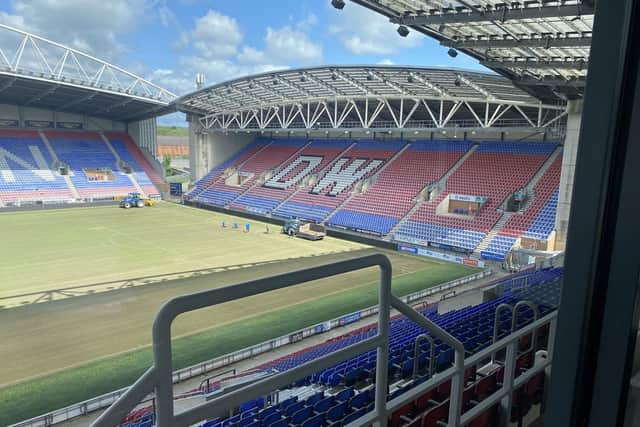 The pitch maintenance is already under way at Wigan Athletic