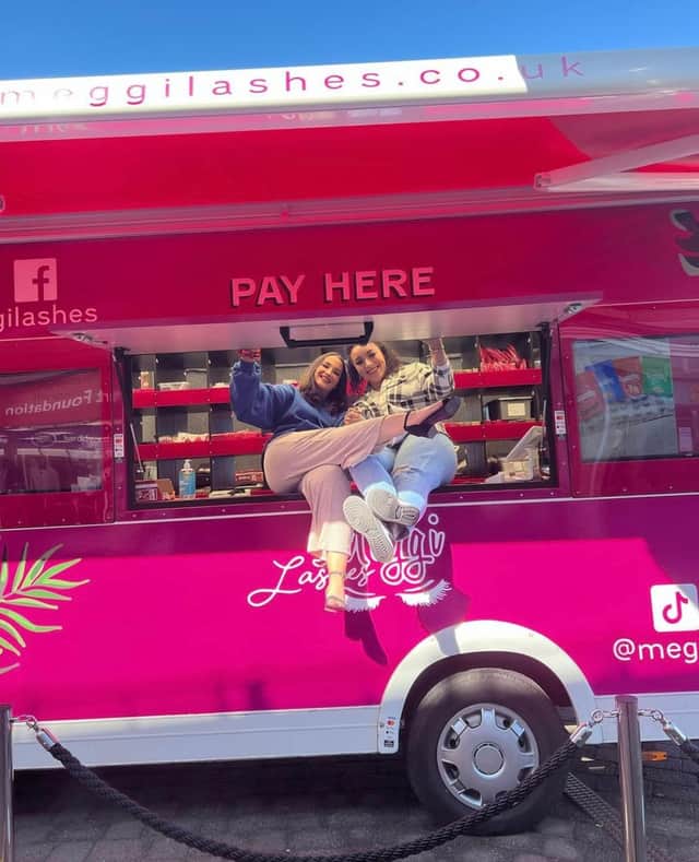 Meggi Morgan, left with staff member Ellie in the Meggi Lashes pop-up van