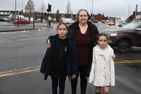 WIGAN - 22-11-23  Victoria El-Hady with her daugher and daughter's school friend, on the junction of Poolstock Lane, Highfield Grange Avenue and Warrington Road, Wigan.   She and other parents are worried about the accidents and road safety.  **didn't want to name the kids*