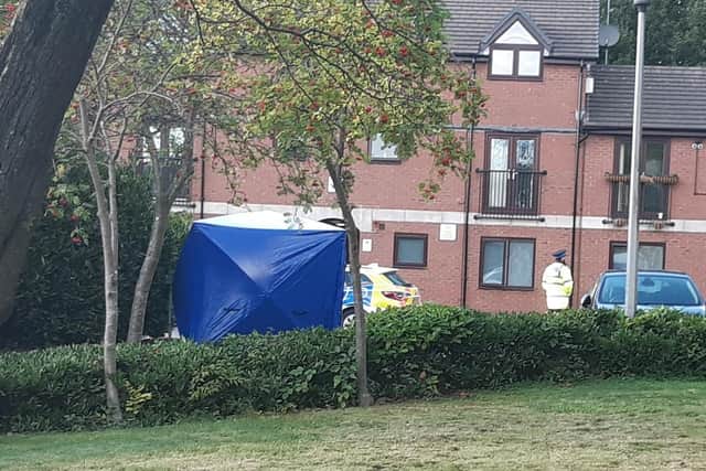 A forensic tent and police outside Markland Court on Frog Lane