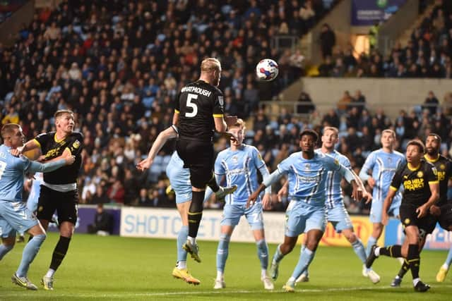 Jack Whatmough competes for a header at Coventry