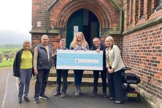 Councillors hand over the cheque