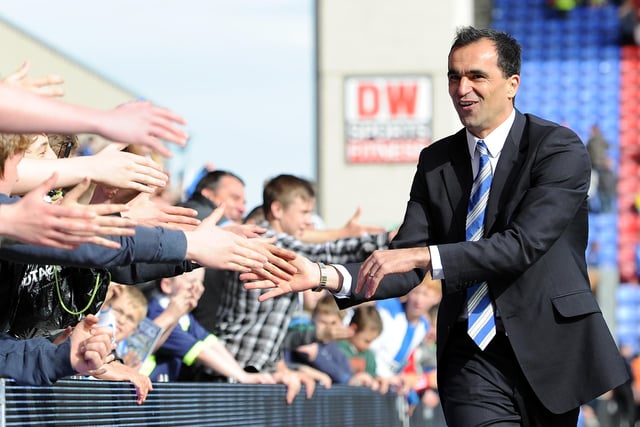 Wigan Athletic manager Roberto Martinez shakes hands with the supporters following the Barclays Premier League match between Wigan Athletic and Wolverhampton Wanderers at DW Stadium on May 13, 2012 in Wigan, England.  (Photo by Chris Brunskill/Getty Images)