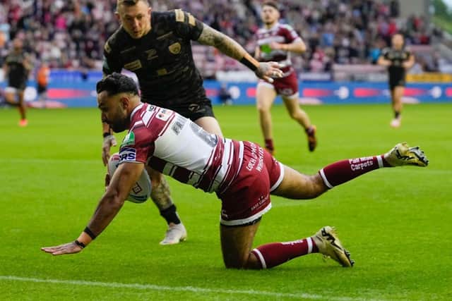 Wigan Warriors full-back Bevan French scores against Leigh Leopards