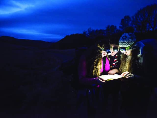 Explorer Scouts on a night hike