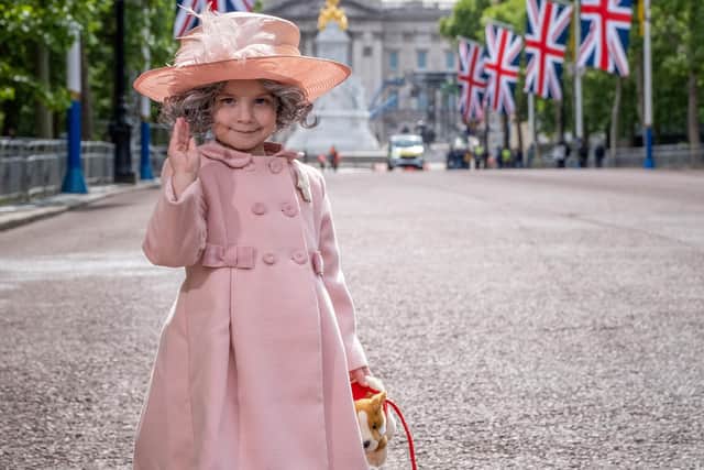 Isla Bates dressed up as mini-queen on the Mall outside Buckinham Palace  in London