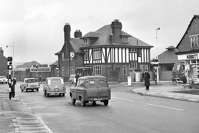 Orrell Post crossroads in the 1960s with Abbott grocery shop on the right and the prominent Stag Inn.