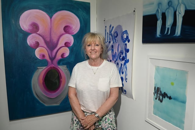 Debra Bundenberg admires work as part of SPLIT2 an exhibition hosted by Cross Street Arts, Standish.