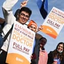 Flags and placards were waved by junior doctors on the picket line outside Wigan Infirmary last year
