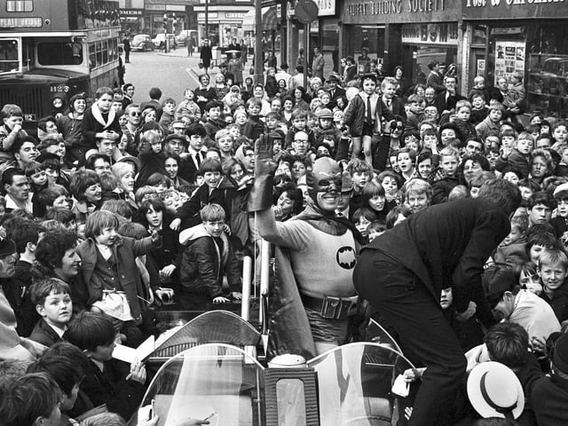 The crowds gather for the arrival of Batman and Robin to open the Green Shield Stamp shop in Crompton Street, Wigan, in 1967.