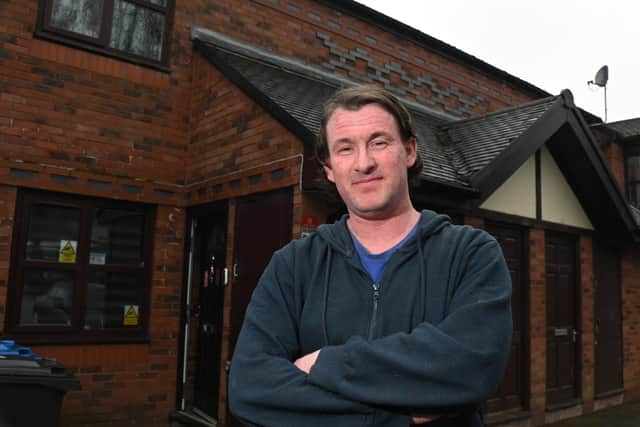 Martin Donegan outside his housing association flat in Woodford Court, Hindley