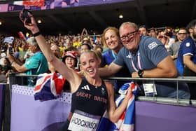 Keely Hodgkinson celebrates her gold medal with coach Trevor Painter in Paris