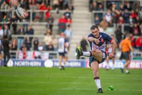 England's Harry Smith kicking a conversion