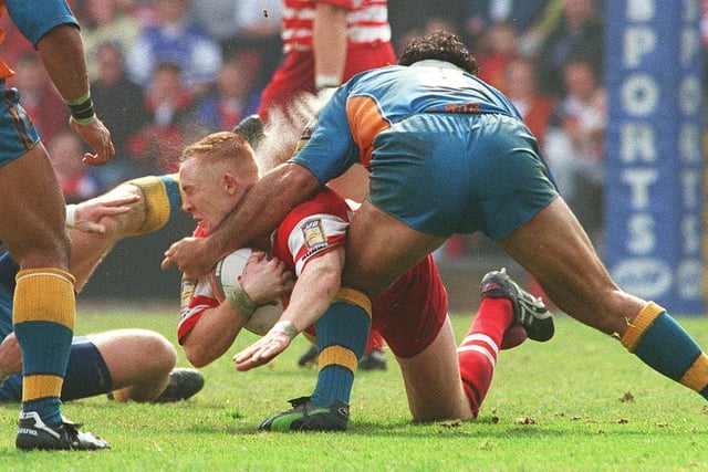 Kris Radlinski feels the full force of Kevin Iro's forearm during Wigan Warriors' game with St Helens at Central Park in 1999