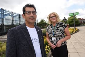 Ahmed Manocher a refugee from Afghanistan, pictured in Believe Square with Wigan Council Service Delivery Footprint manager Joanne Edwards