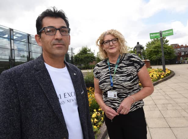 Ahmed Manocher a refugee from Afghanistan, pictured in Believe Square with Wigan Council Service Delivery Footprint manager Joanne Edwards