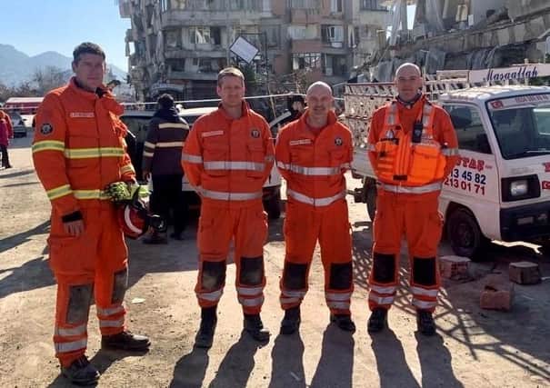 Steven Pennington (far left) helped rescue a woman trapped in a building in Hatay after tracing her voice for 17 hours