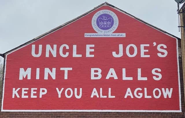 The royal goodwill message on the gable end of the William Santus factory in Dorning Street