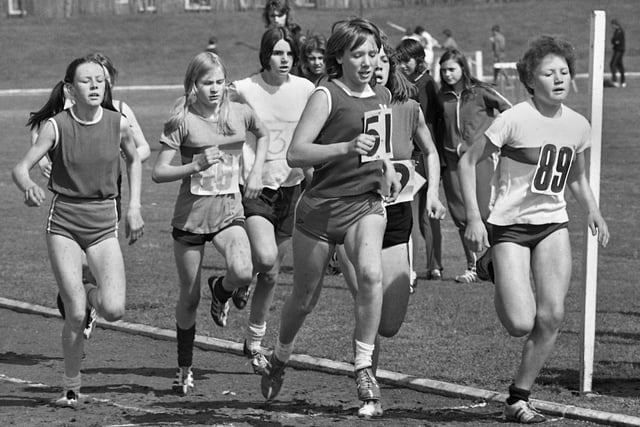 A junior girls 800 metres race at the Lancashire Schools Athletics Championships held at Woodhouse Stadium on Saturday 8th of June 1974.