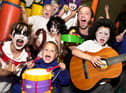 Rock School - Frontman with Wigan rock band Moco, Steve Jones, and youngsters at the Wiend Children's Centre where he had his own "After School of Rock".
Steve was a Wiend Centre worker trying to keep groups of 5 to 11 year olds occupied learning about writing, recording and performing their own songs.
They had already done some writing together and composed a song about footballer Wayne Rooney in September 2004.