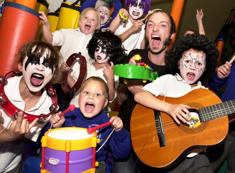Rock School - Frontman with Wigan rock band Moco, Steve Jones, and youngsters at the Wiend Children's Centre where he had his own "After School of Rock".
Steve was a Wiend Centre worker trying to keep groups of 5 to 11 year olds occupied learning about writing, recording and performing their own songs.
They had already done some writing together and composed a song about footballer Wayne Rooney in September 2004.