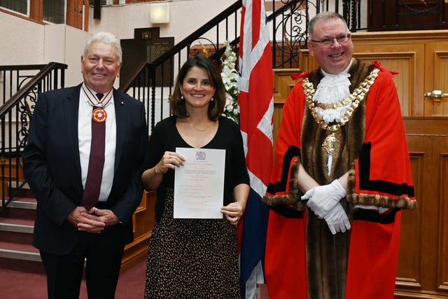 Greater Manchester Deputy Lieutenant Martin Ainscough, left,  and Mayor of Wigan Coun Kevin Anderson, right, welcomes Wigan's new British Citizens as certificates were presented at the monthly British Citizenship ceremony held at Wigan Town Hall.