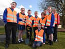Eco-warriors at St John's CE Primary school in Abram plant cherry trees
