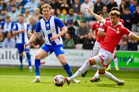 Jensen Weir puts himself about in the midfield against Wrexham