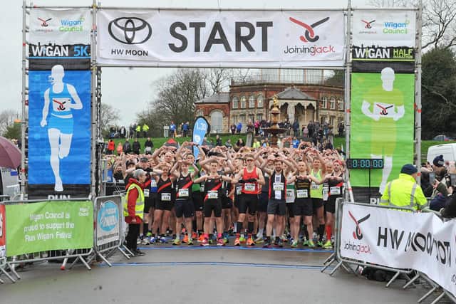 Participants do the Joining Jack salute at the start line of last year's Run Wigan Festival
