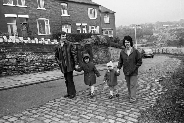 John and Gwenda Gallagher with children, Julie and Tracy, in Coppull Lane, Swinley, in December 1974. In the background are Bottling Wood and the Bloody Mountains, site of the civil war battle in August 1651.