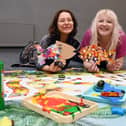 Wigan artists Ellie Leigh, left, and  Anna FC Smith,  at the free toddler orientated art workshop and messy play session, taking inspiration from Seeing Things exhibition, at The Edge, Wigan.