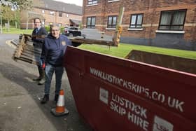 Neil West and Coun Chris Ready, right, filling one of the skips at Aspull Allotments. This is the fourth skip supplied by Lostock Skip Hire