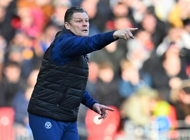 Shrewsbury Town's English manager Steve Cotterill shouts instructions to his players from the touchline during the English FA Cup third round football match between Liverpool and Shrewsbury Town at Anfield in Liverpool, north west England on January 9, 2022.