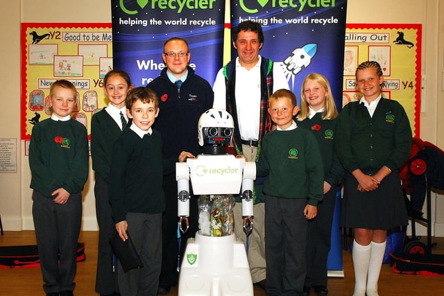 Dave Taggart and Nick Deakin with Recycler the robot at Woodfield Primary School Wigan.